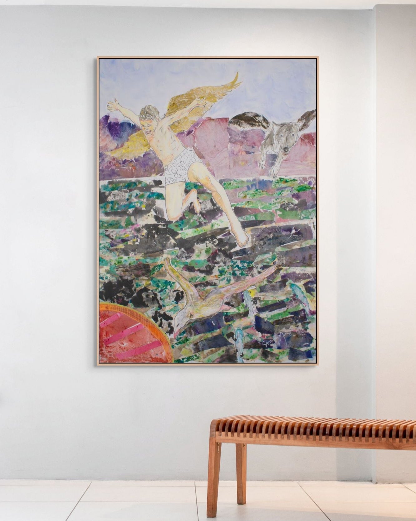 Framed abstract leap of faith painting on a wall with a wooden bench below